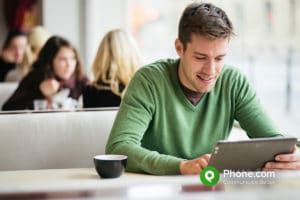 Man using tablet in a cafe