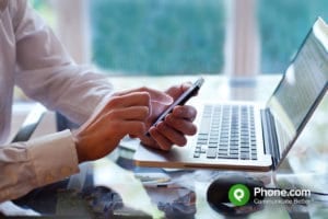 businessman using voip phone in office