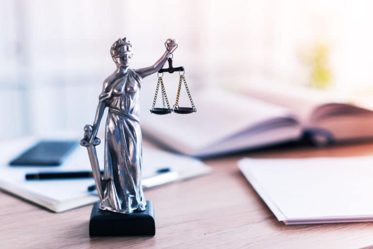 Lady Justice statue in law firm attorney office