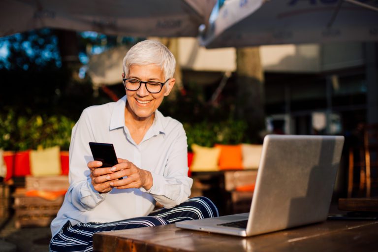 Woman texting on a mobile PBX.