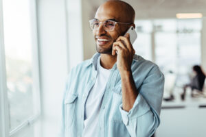 Business professional using a mobile business phone number on smartphone with eSIM technology.