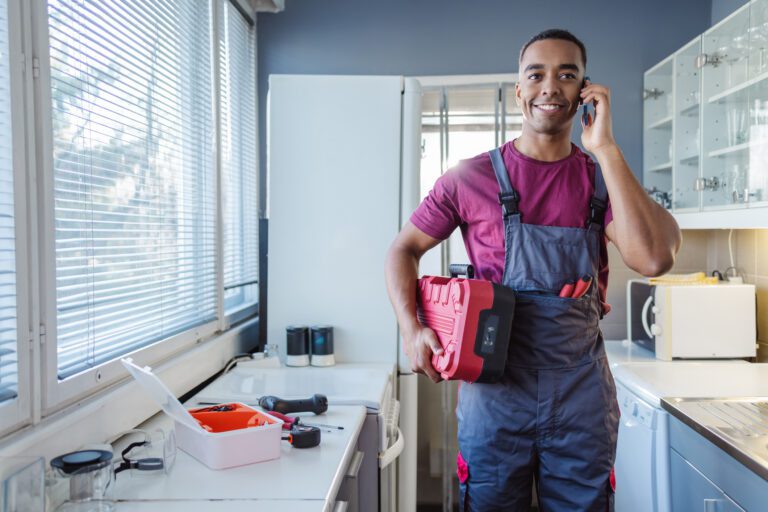 Home services worker managing calls from a mobile phone.