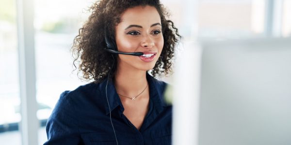 Shes determined to help as many customers as possible. Cropped shot of an attractive young female call center agent working in her office. Young woman working as a live receptionist.